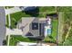 Aerial view of a home with solar panels, landscaped yard, and a swimming pool and patio area for outdoor enjoyment at 5050 Havencrest Dr, Fort Mill, SC 29715