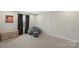 Cozy bedroom with neutral tones, a soft beanbag chair, and a built-in bookshelf at 5050 Havencrest Dr, Fort Mill, SC 29715
