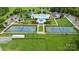 Aerial view of community amenities, including a pool, tennis courts, clubhouse, playground, and parking at 5050 Havencrest Dr, Fort Mill, SC 29715