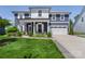 Inviting two-story home boasting a covered porch, pristine lawn, and attached two-car garage at 5050 Havencrest Dr, Fort Mill, SC 29715