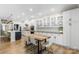 Eat-in kitchen boasts white cabinets, modern backsplash, and a butcher block breakfast table at 5050 Havencrest Dr, Fort Mill, SC 29715