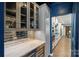 Stylish kitchen with white cabinets, wine cooler, designer backsplash, and modern appliances at 5050 Havencrest Dr, Fort Mill, SC 29715