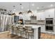 Modern kitchen with stainless steel appliances, white cabinets, and a center island with seating at 5050 Havencrest Dr, Fort Mill, SC 29715