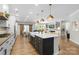 Spacious kitchen with an oversized island, modern appliances and farmhouse sink at 5050 Havencrest Dr, Fort Mill, SC 29715