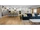 Open-concept living room with bar seating flows into a well-appointed kitchen with modern appliances at 5050 Havencrest Dr, Fort Mill, SC 29715