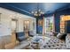 Cozy living room with a tufted sofa, modern lighting, and views into other rooms at 5050 Havencrest Dr, Fort Mill, SC 29715