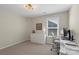Well-lit office space with ample storage, modern desk setup, and a comfortable chair for an efficient workspace at 5050 Havencrest Dr, Fort Mill, SC 29715