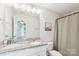 Neutral bathroom with granite double vanity, large mirror, and good lighting at 507 Newsome Rd, Salisbury, NC 28146