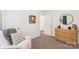 Comfortable bedroom with a soft chair, dresser, and carpet at 507 Newsome Rd, Salisbury, NC 28146