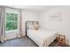 Cozy bedroom with a comfortable bed and natural light streaming through the window with beautiful forest view at 507 Newsome Rd, Salisbury, NC 28146