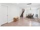 Hallway featuring an open dining area, stairs, a playroom, and wood flooring with a neutral color palette at 507 Newsome Rd, Salisbury, NC 28146