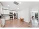 Bright kitchen features white cabinets, stainless steel appliances, and wood floors at 507 Newsome Rd, Salisbury, NC 28146