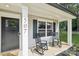 Inviting front porch with two rocking chairs and a storm door entrance featuring a lovely place to sit and relax at 507 Newsome Rd, Salisbury, NC 28146