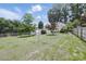 A view of a well maintained backyard with a fence and storage building at 522 Alexander St, Statesville, NC 28677
