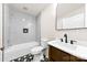 Updated bathroom showcasing a black and white tile floor, new vanity, and tiled shower at 522 Alexander St, Statesville, NC 28677