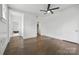 Bright and spacious room featuring hardwood floors and multiple entryways leading to other rooms at 522 Alexander St, Statesville, NC 28677