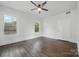 Bedroom featuring hardwood floors, white walls and ceilings and a ceiling fan at 522 Alexander St, Statesville, NC 28677
