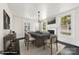 Elegant dining room featuring a modern chandelier, fireplace, and large windows at 522 Alexander St, Statesville, NC 28677