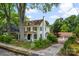 Spacious home with a detached garage, mature trees, and a well-manicured lawn at 522 Alexander St, Statesville, NC 28677