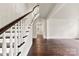 Elegant foyer showcasing a beautiful curved staircase and hardwood floors at 522 Alexander St, Statesville, NC 28677