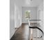 Hallway featuring hardwood floors and white walls, leading to other rooms in the home at 522 Alexander St, Statesville, NC 28677