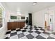 Bright kitchen features black-and-white floors, green cabinets, and a convenient breakfast bar at 522 Alexander St, Statesville, NC 28677