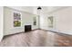 Bright living room featuring a fireplace and large windows, showcasing the home's natural light at 522 Alexander St, Statesville, NC 28677