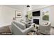 Bright living room featuring a fireplace, large windows, and stylish neutral furniture at 522 Alexander St, Statesville, NC 28677