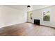 Bright living room featuring a fireplace and large windows, showcasing the home's original features at 522 Alexander St, Statesville, NC 28677