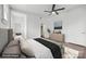 Light-filled main bedroom features a ceiling fan, neutral tones and en-suite bathroom access at 522 Alexander St, Statesville, NC 28677
