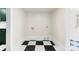 View of a utility area featuring green accents and black and white checkered tile flooring at 522 Alexander St, Statesville, NC 28677