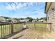 Wooden deck overlooking a spacious backyard with greenery at 5333 Lake Glenn Dr, Stanfield, NC 28163