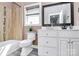Bathroom featuring a toilet, tub with tiled shower, sink vanity and wood-look floors at 5333 Lake Glenn Dr, Stanfield, NC 28163