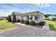 Attractive single-story home with a covered porch and manicured shrubs lining the walkway at 5333 Lake Glenn Dr, Stanfield, NC 28163