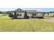 Inviting single-story home with a well-maintained lawn and front porch, perfect for relaxation at 5333 Lake Glenn Dr, Stanfield, NC 28163