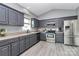Updated kitchen featuring gray cabinets, stainless appliances, and plenty of counter space at 5333 Lake Glenn Dr, Stanfield, NC 28163