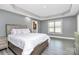Main bedroom featuring wood look floors, tray ceiling, and neutral walls at 5333 Lake Glenn Dr, Stanfield, NC 28163