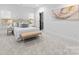 Serene bedroom with neutral tones, ample natural light, and a cozy sitting area at 5615 Lantana Ave # A, Charlotte, NC 28205