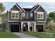 Charming two-story home with a welcoming entrance and beautiful landscaping, featuring a tandem two-car garage at 5615 Lantana Ave # A, Charlotte, NC 28205