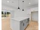 Bright kitchen features an oversized island with seating and modern stainless steel appliances at 5615 Lantana Ave # A, Charlotte, NC 28205