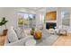 Bright living room with modern furniture, a fireplace, and sliding doors that open to outdoor space at 5615 Lantana Ave # A, Charlotte, NC 28205