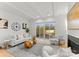 Well-lit living room with stylish furniture, a fireplace, and access to the outdoor area via sliding glass doors at 5615 Lantana Ave # A, Charlotte, NC 28205
