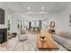 Open-concept living space with a fireplace, modern decor, and seamless transition to the dining area at 5615 Lantana Ave # A, Charlotte, NC 28205