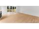 Living room with wood-look floors, sliding glass doors and backyard access at 5615 Lantana Ave # A, Charlotte, NC 28205