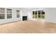 Bright living room features a modern fireplace and sliding glass doors overlooking the backyard at 5615 Lantana Ave # A, Charlotte, NC 28205