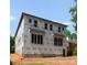 Exterior view showcasing new construction with large windows and Tyvek HomeWrap at 5615 Lantana Ave # B, Charlotte, NC 28205