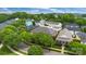 Scenic aerial view of a neighborhood with tree-lined streets and well-maintained homes, conveying a sense of community at 6011 Nw Village Nw Dr, Concord, NC 28027