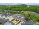 Aerial view of a suburban community highlights spacious lots, well-kept homes, and ample parking with mature trees at 6011 Nw Village Nw Dr, Concord, NC 28027