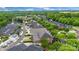 Overhead view of a residential area featuring a mix of single-Gathering homes surrounded by lush greenery and mature trees at 6011 Nw Village Nw Dr, Concord, NC 28027