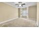 Large carpeted bedroom featuring a ceiling fan and a bay window at 6011 Nw Village Nw Dr, Concord, NC 28027
